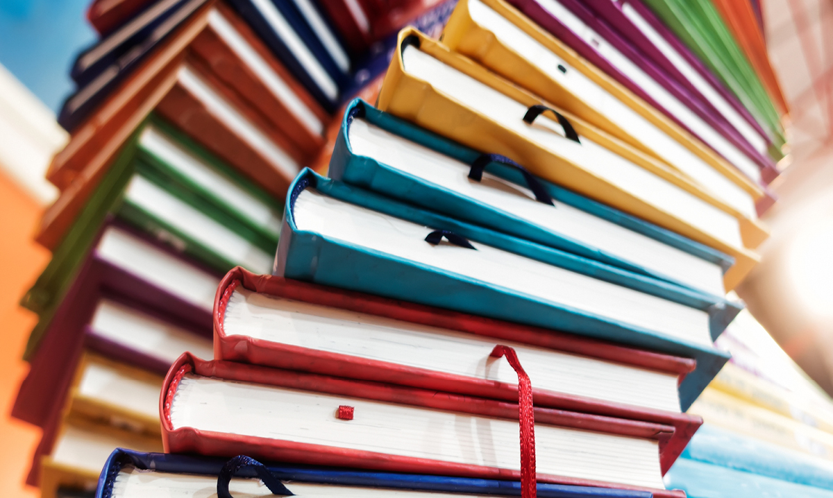 Stacks of different colored books