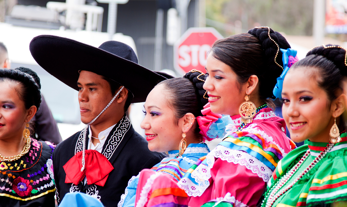 Five performers pose for the camera during a Cinco de Mayo Celebration