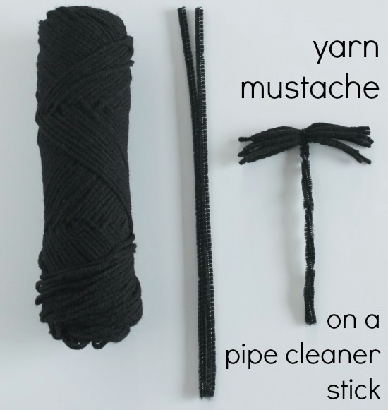 Yarn mustache on a stick