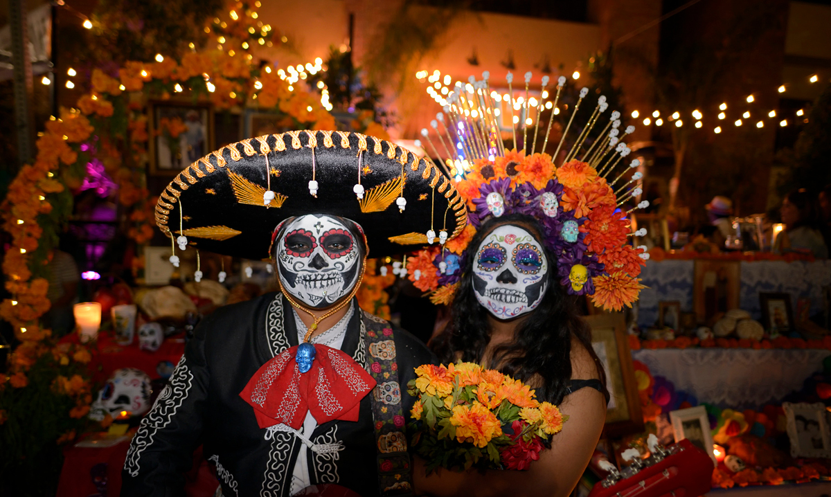 two people in day of the dead costume