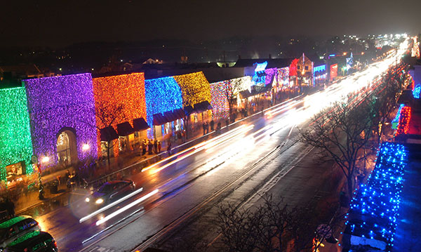 Buildings covered in holiday lights