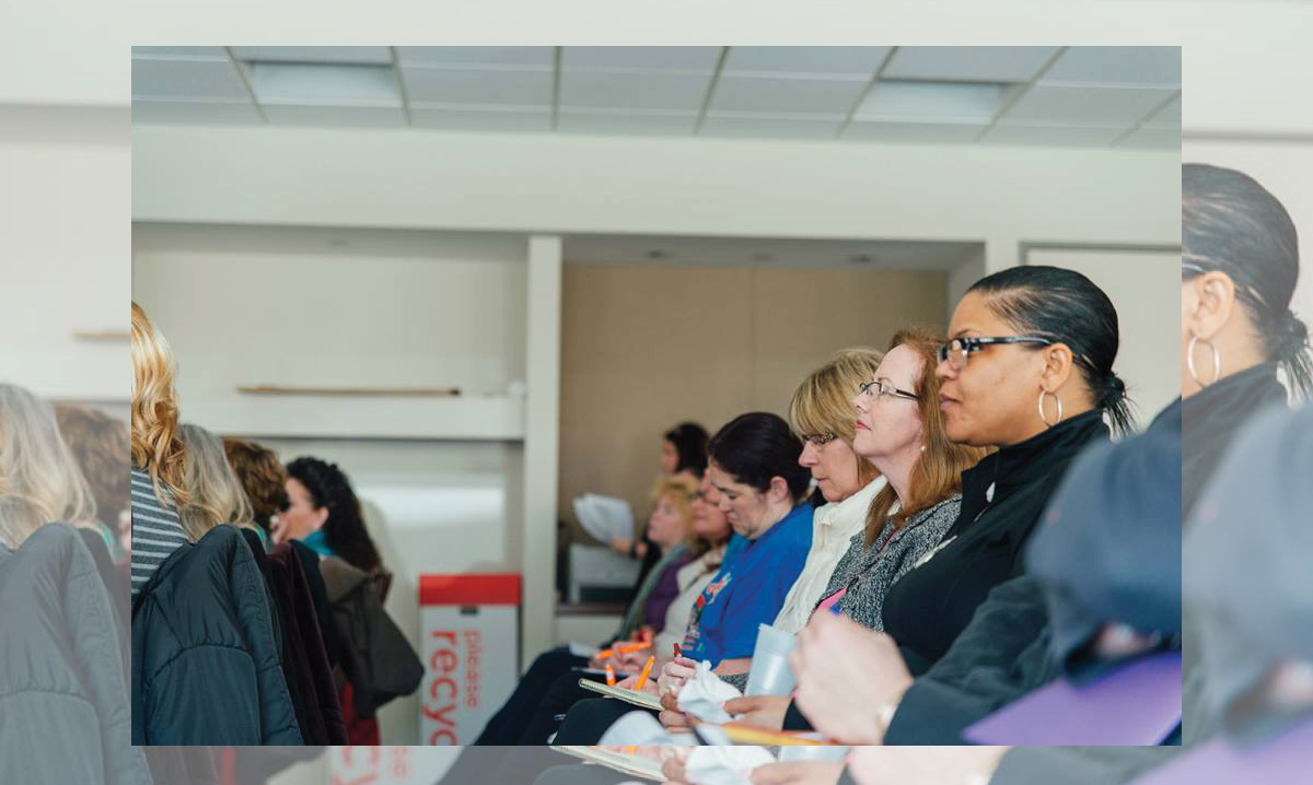 Parents listening to a keynote speaker
