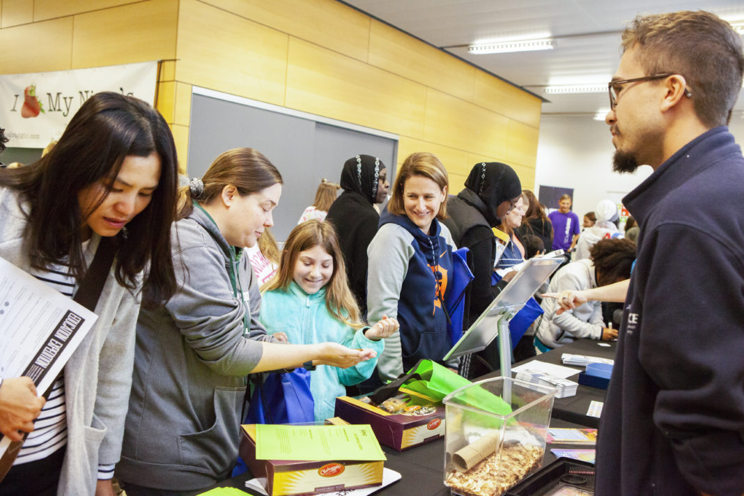 Attendees visit tables at the Education Expo on Sept. 30 at Cranbrook Institute of Science.