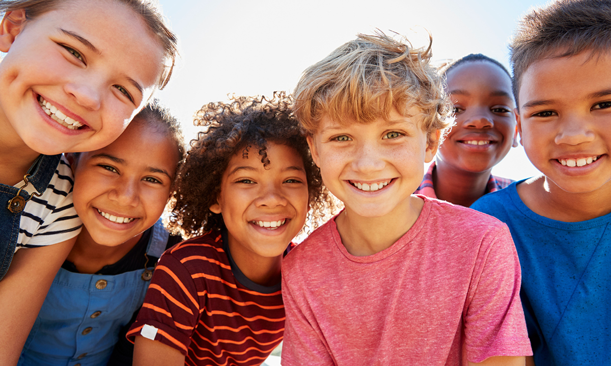 Group of young boys and girls smiling