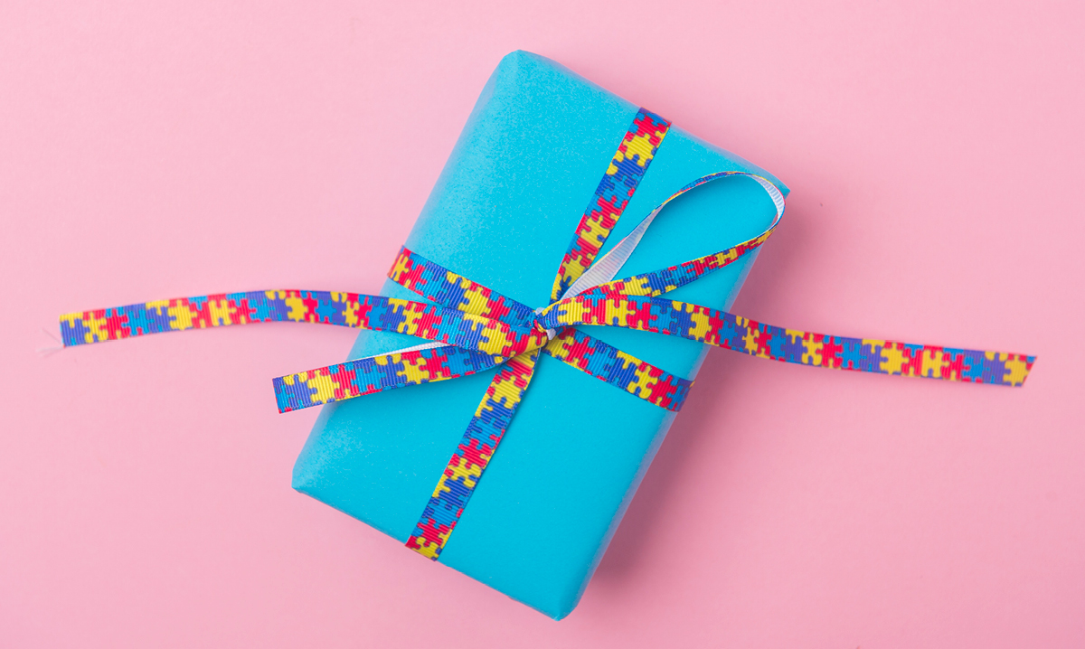 A blue gift on a pink background