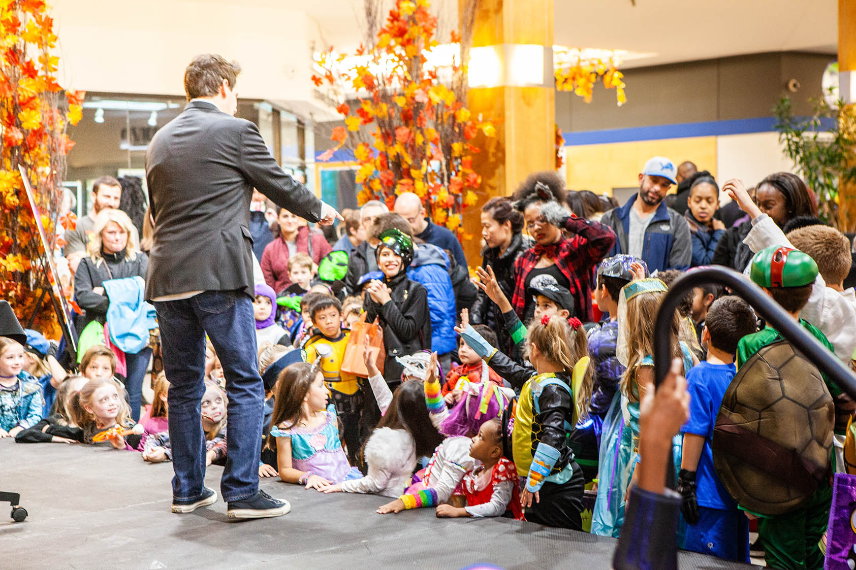 Monster Mash attendees watch Jasen Magic at Orchard Mall on Oct. 26, 2018.