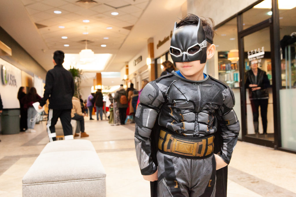 Bat boy outfitted kid