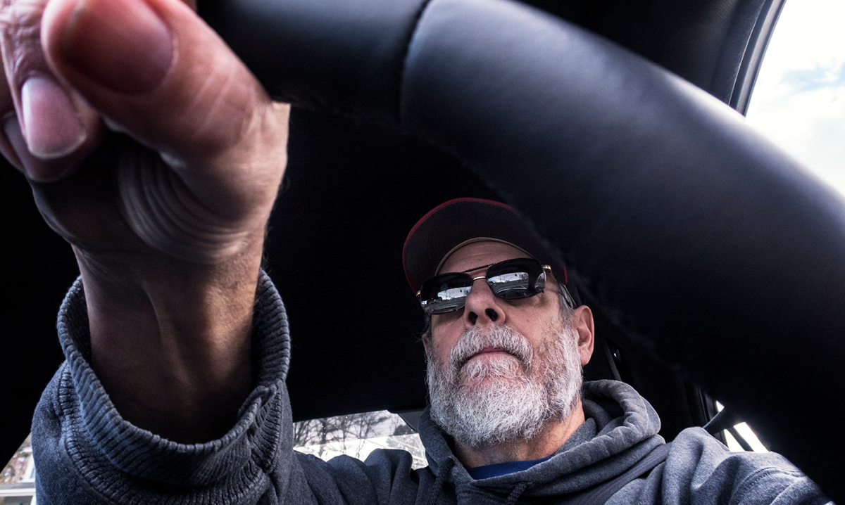 Older person and steering wheel