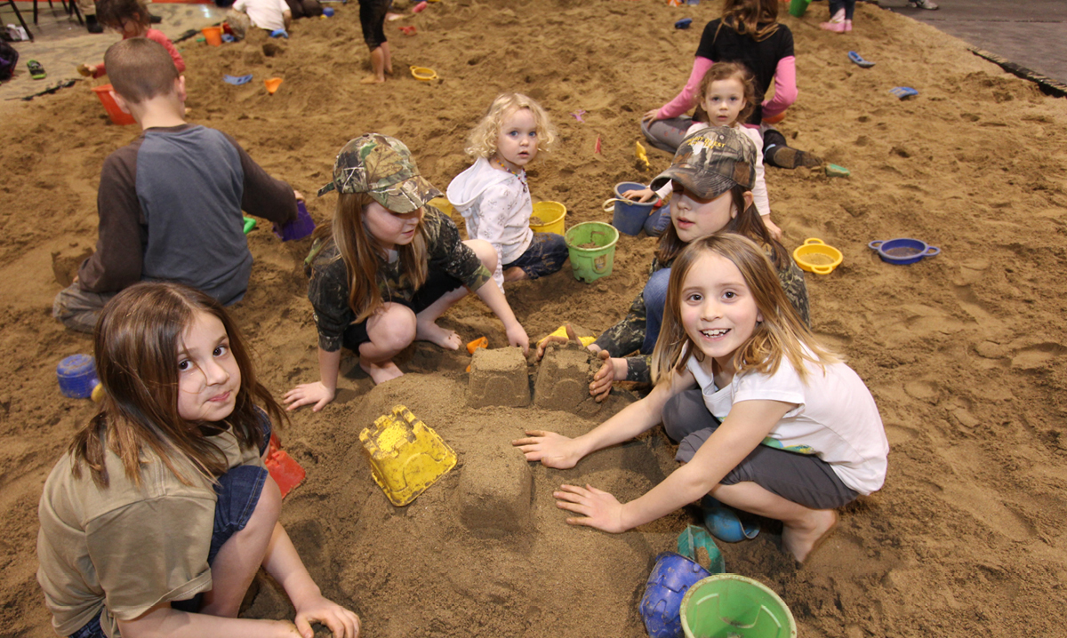 Kids playing in the sandbox at Outdoorama