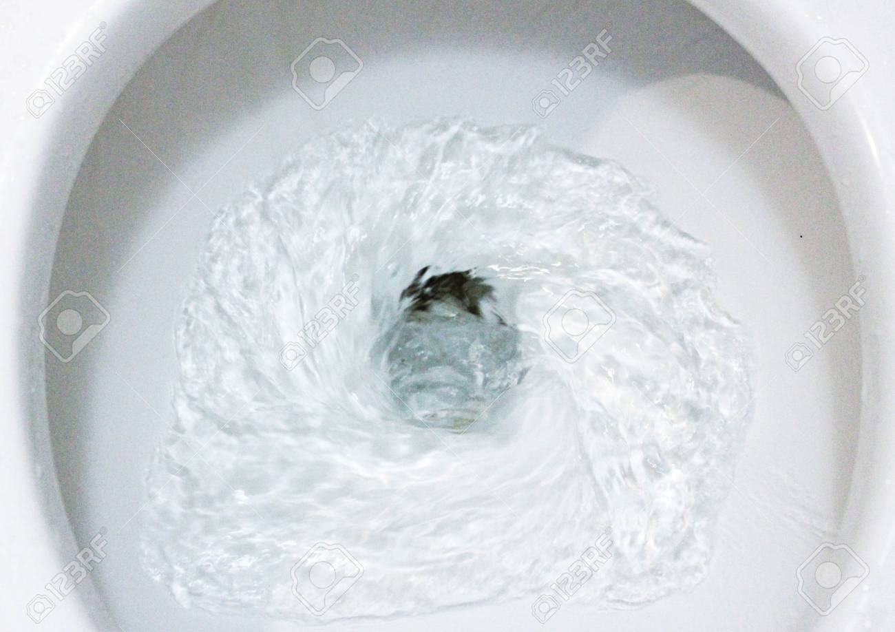 White, clean toilet flushing