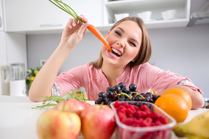 Teen eating fruits and veggies