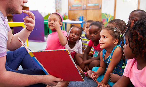 Kids being read a book