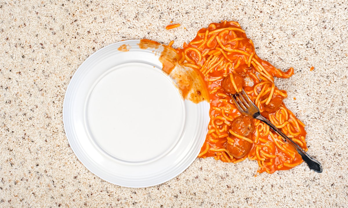 Pasta and spaghetti sauce fell on a carpet.