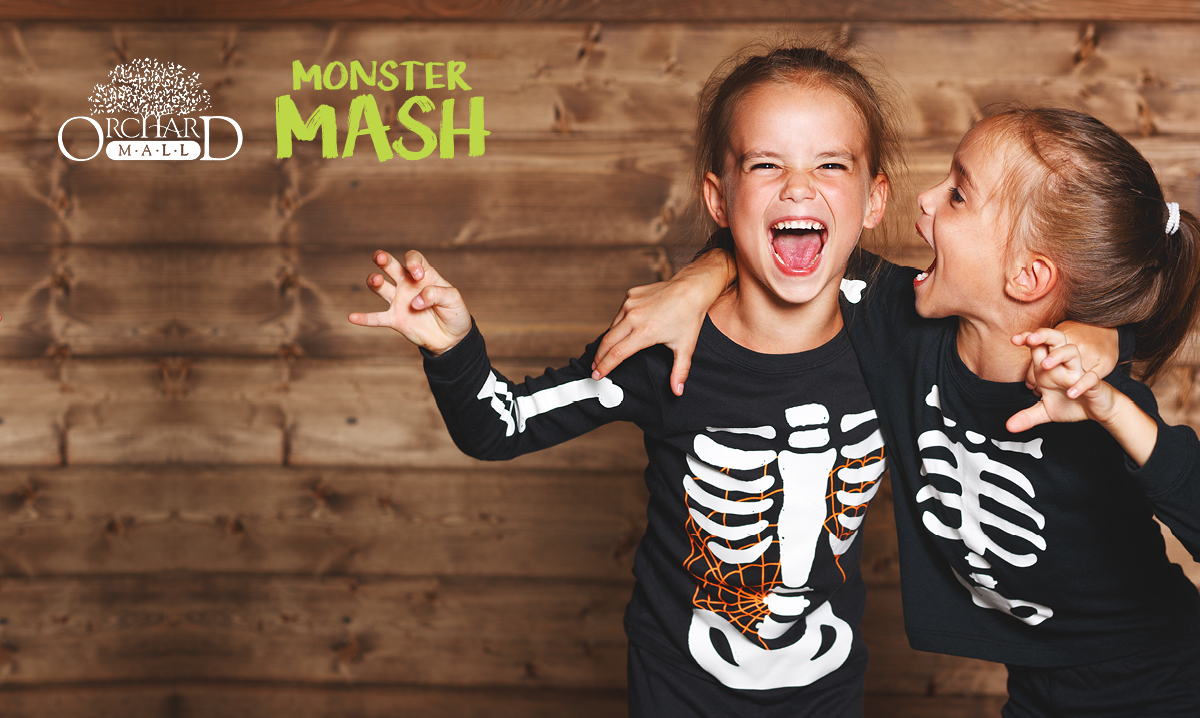 Monster Mash Two kids dressed up as skeletons for Halloween