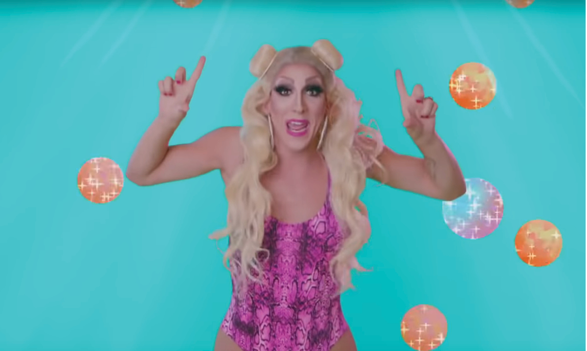 Screenshot of drag queen Marti Gould Cummings in their video for baby shark