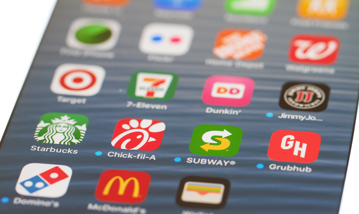 Smartphone showing various food delivery apps