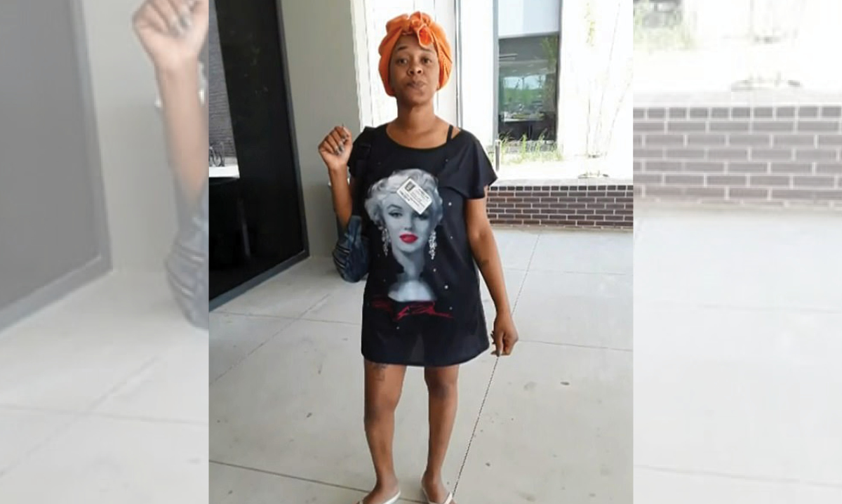 Joselyn Lewis poses in the outfit that got her kicked out of her child's school