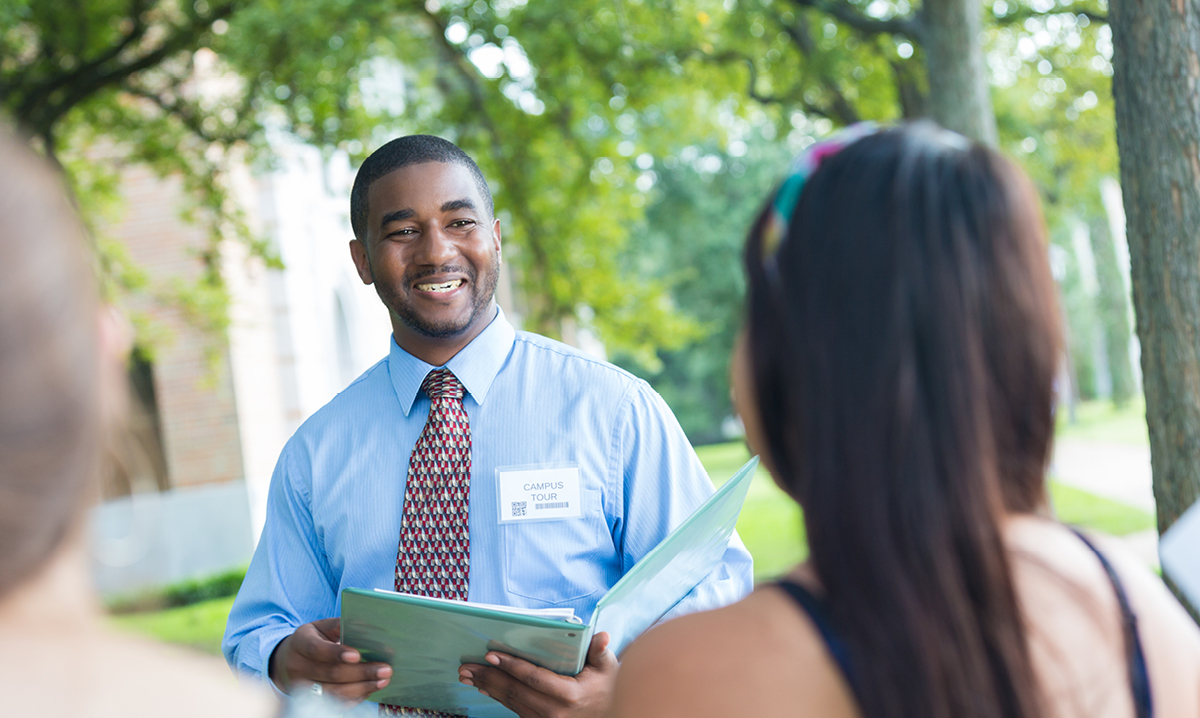 A college campus tour guide with a prospective student