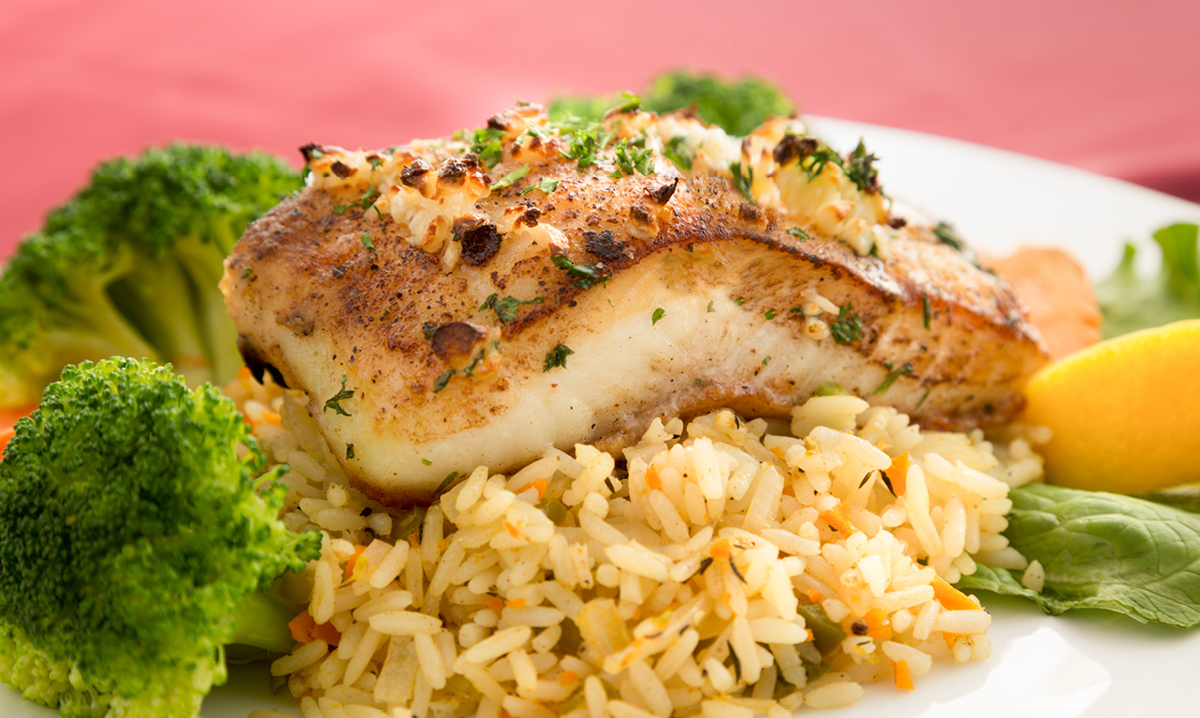 Halibut on rice with broccoli and vegetables