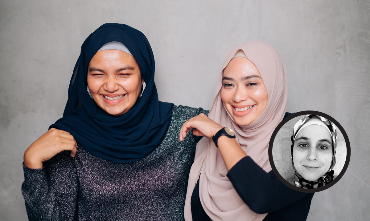 Daughter smiles while standing next to her mom