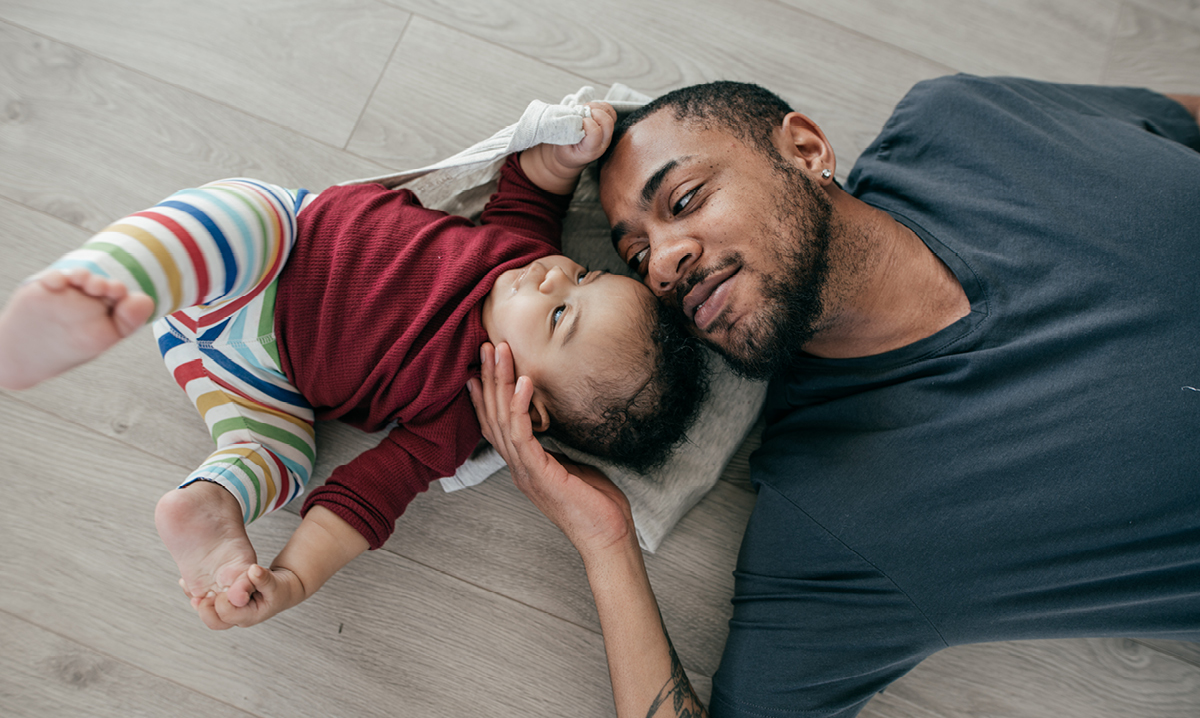 Dad plays with baby