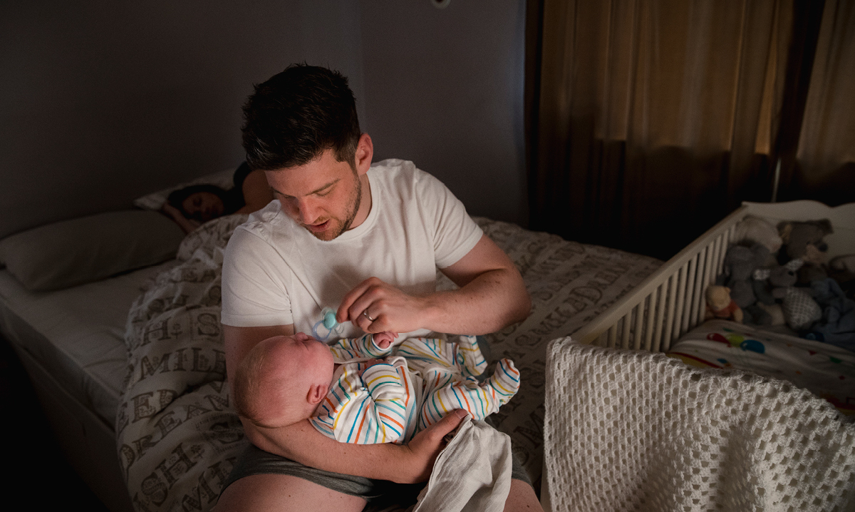 Dad soothes baby during the night