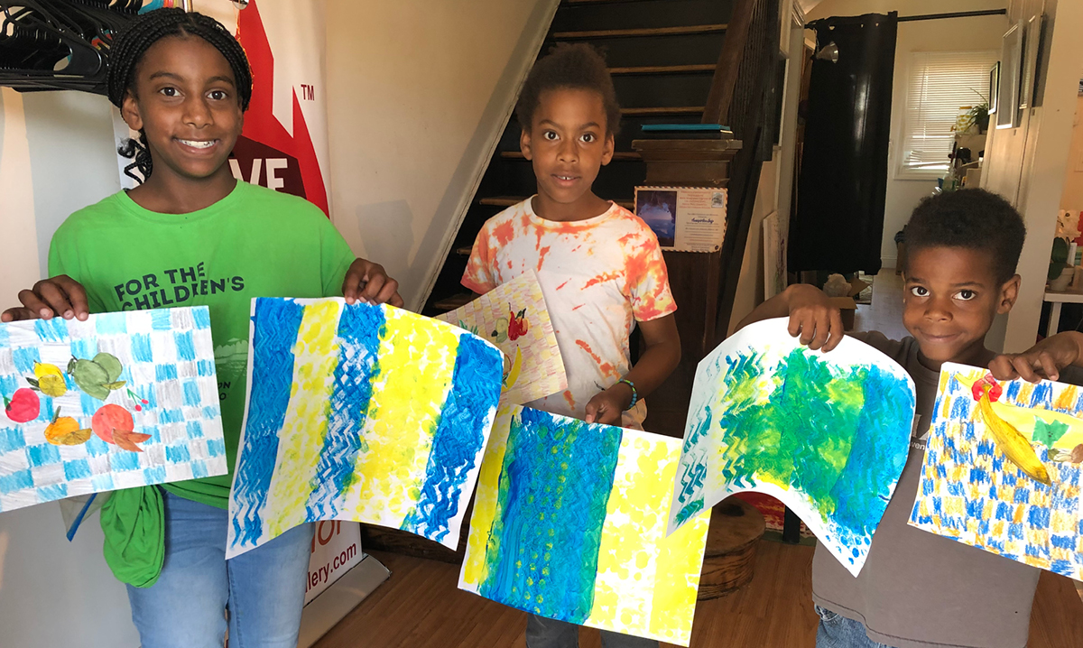 Kids display artwork at The Red Children's Art Museum