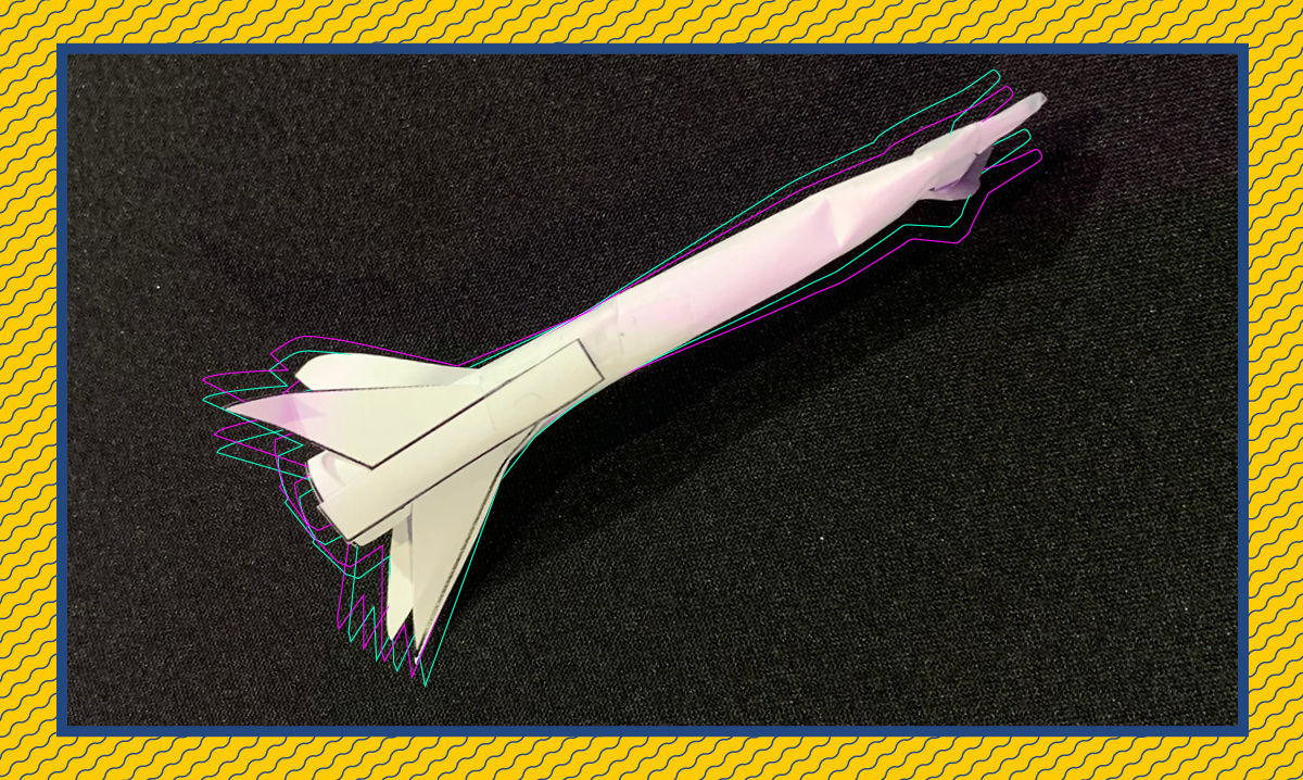straw rocket on a black background with a yellow border