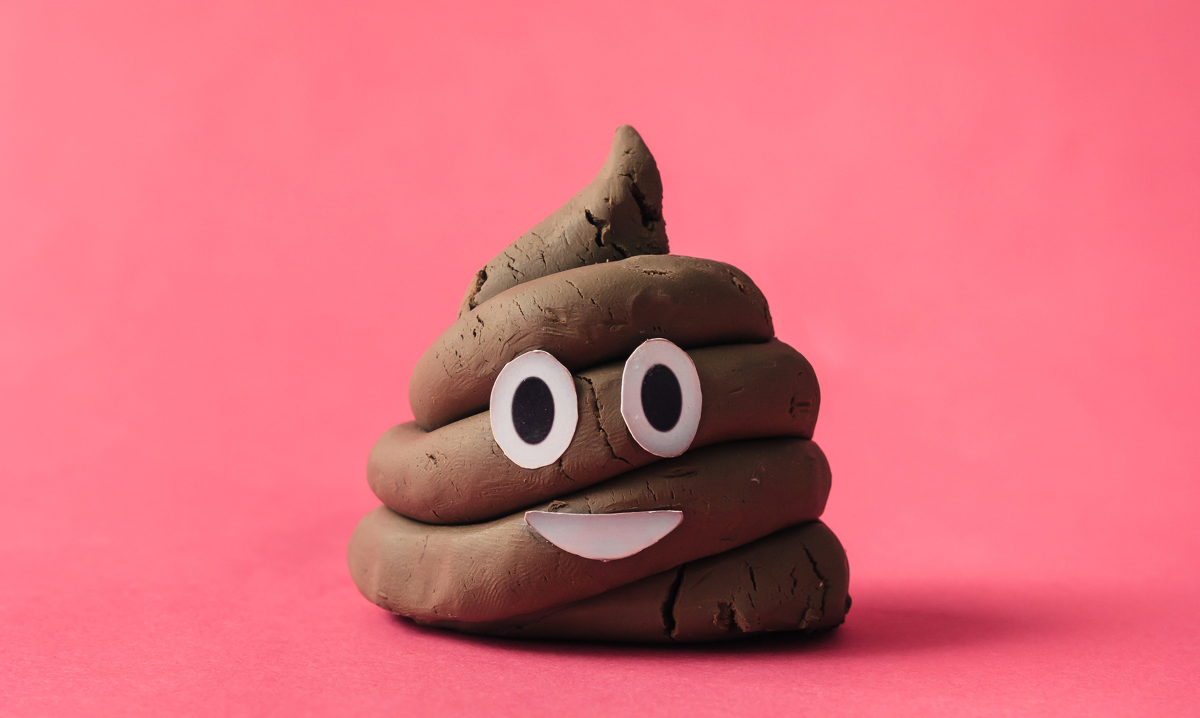 Poop emoji on pink background
