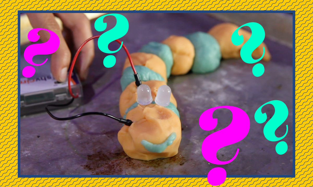 squishy circuits creature on a purple background surrounded by pink and teal question marks