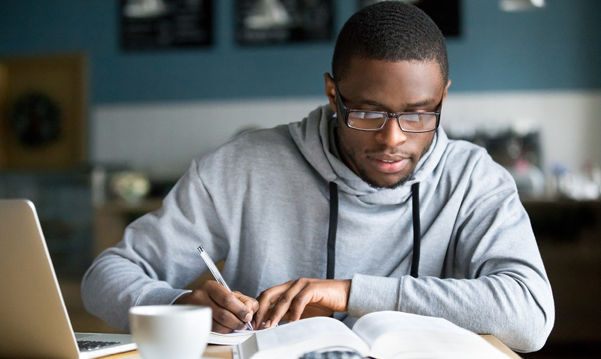 high school aged boy studying