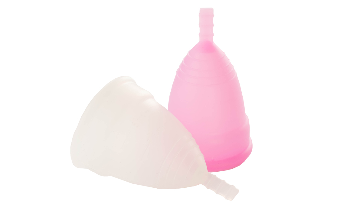 A pink and clear menstrual cup on a white background