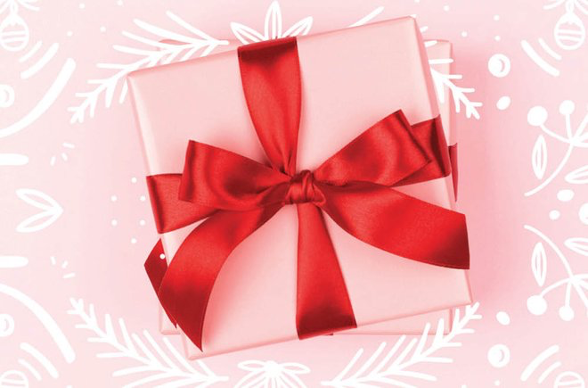 Pink gift with a red bow on a pink background