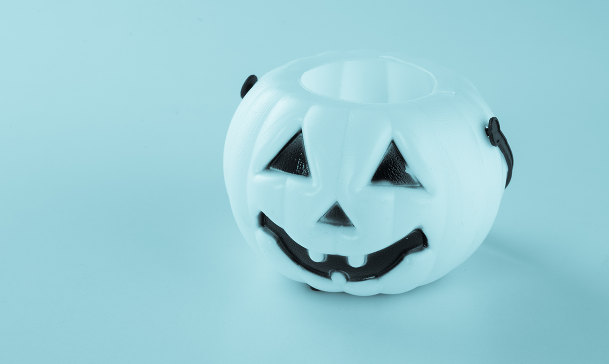 blue trick-or-treating bucket on a blue background