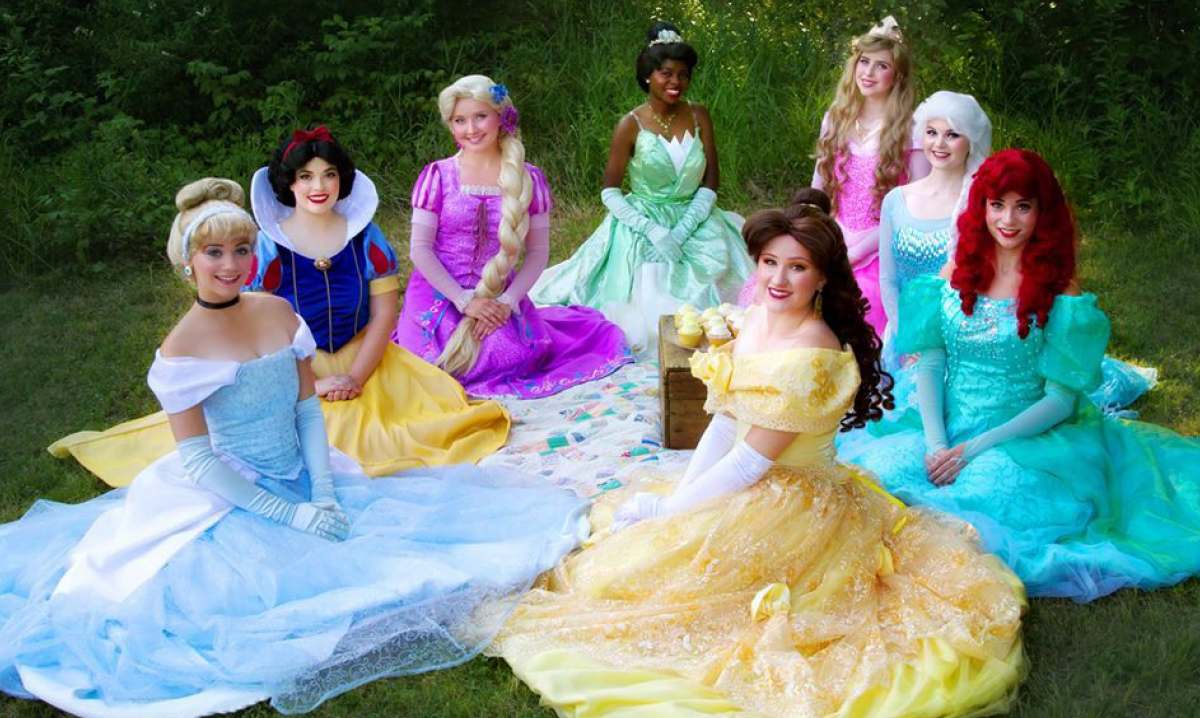 Disney princesses sitting on the ground