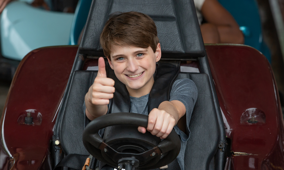 Young boy driving a go-kart at C.J. Barrymore's