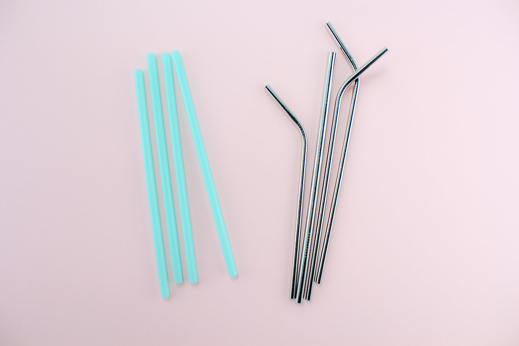 reusable straws on a pink background