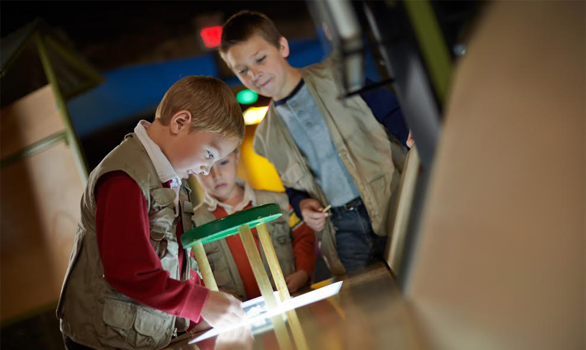 Kids playing at a museum in Lansing