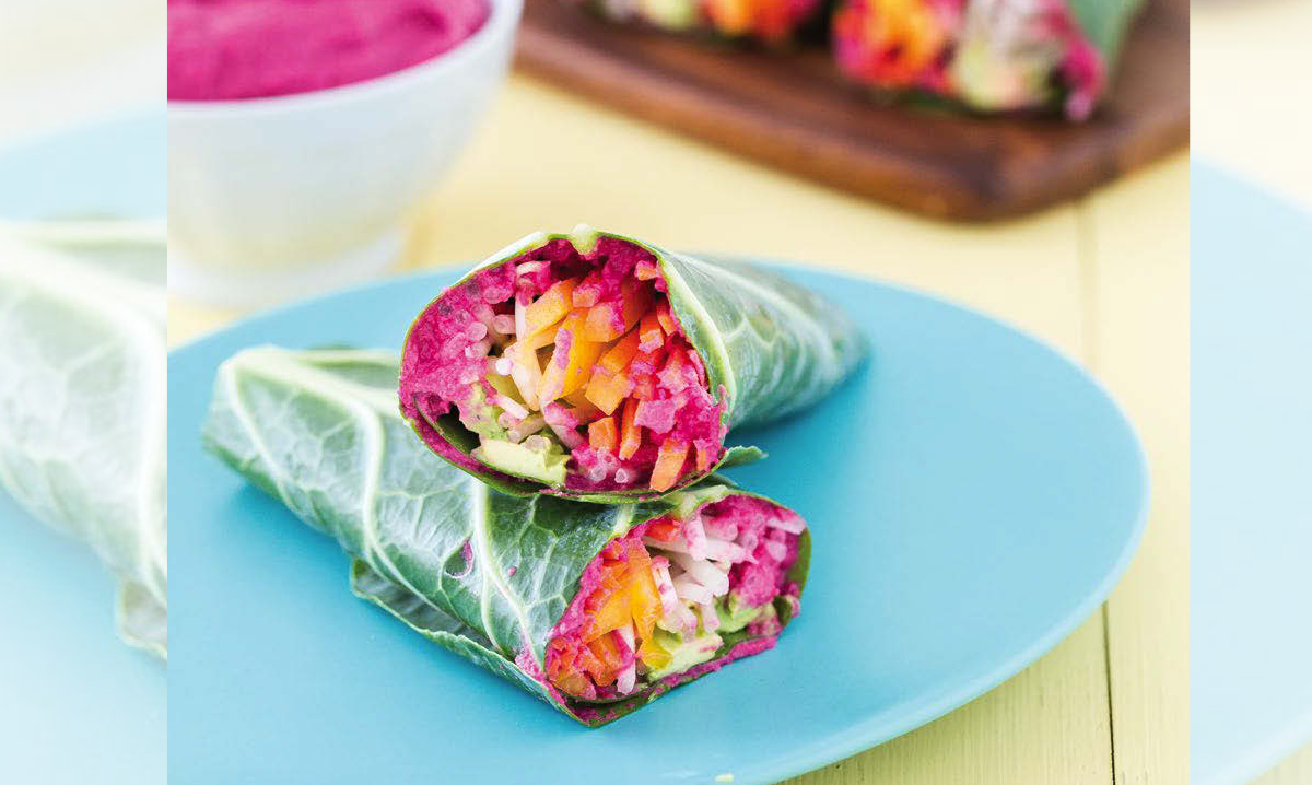 beet hummus collard wraps on a blue plate