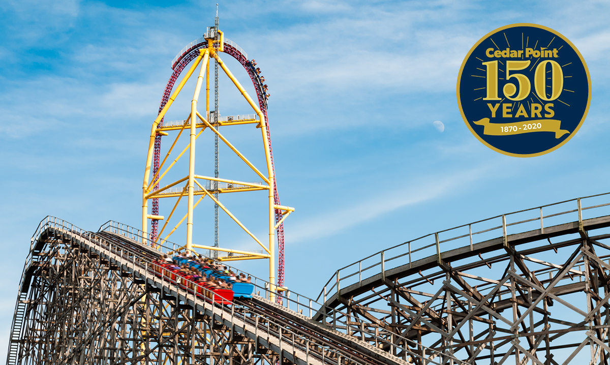Gemini and Top Thrill Dragster at Cedar point with a blue sky backgroun, a circle says 150 years in the front
