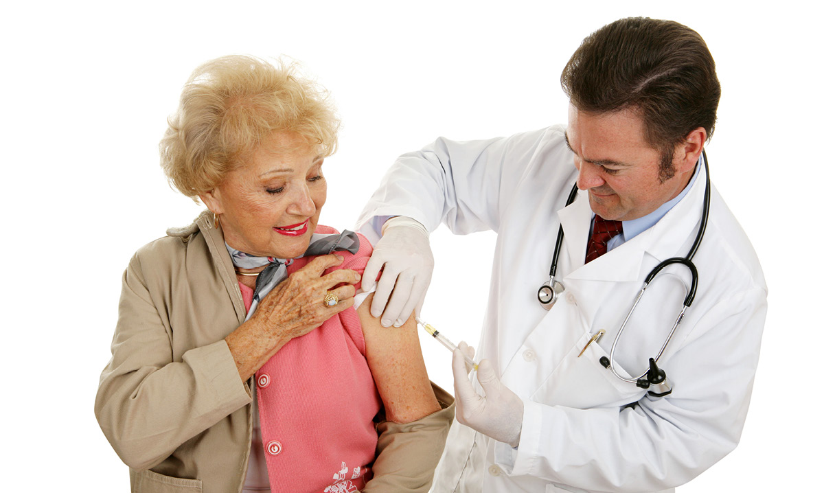 Elderly woman getting a shot