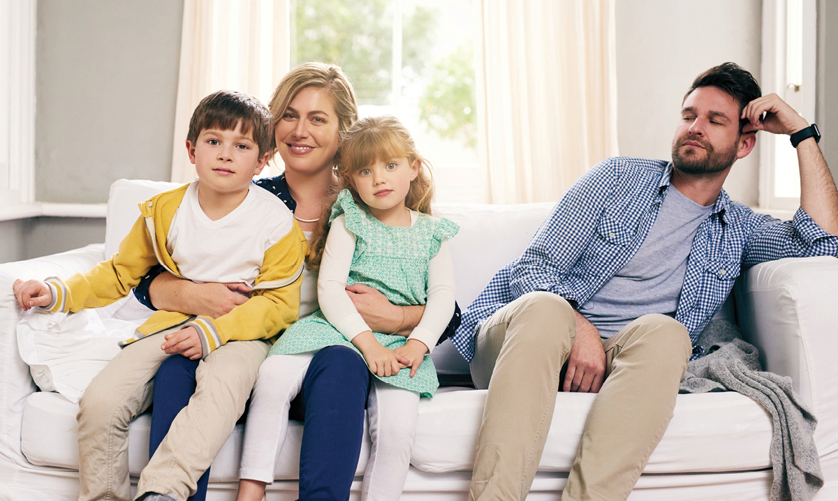 Woman holding kids away from man