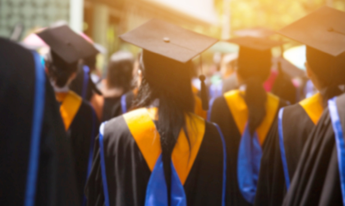 Group of people in college caps and gowns