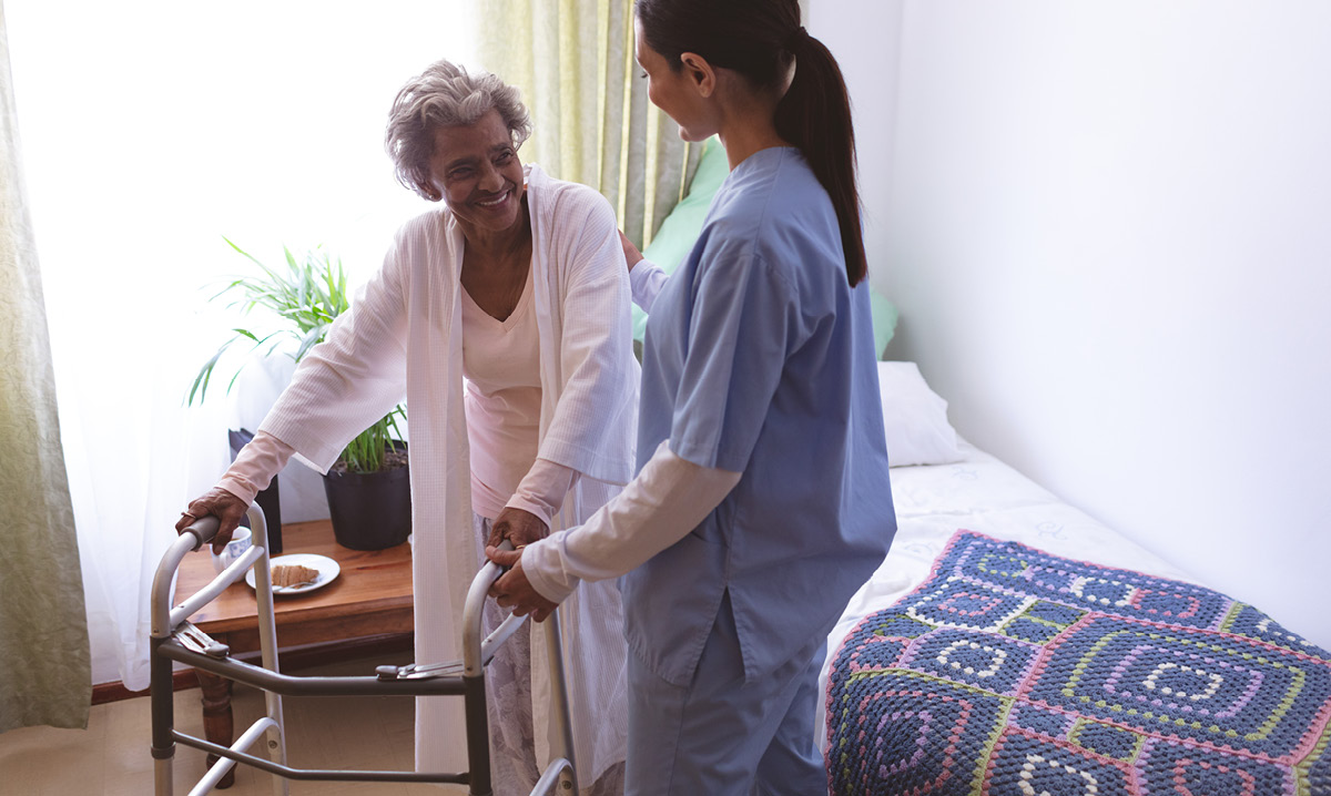Nurse helping an elderly woman