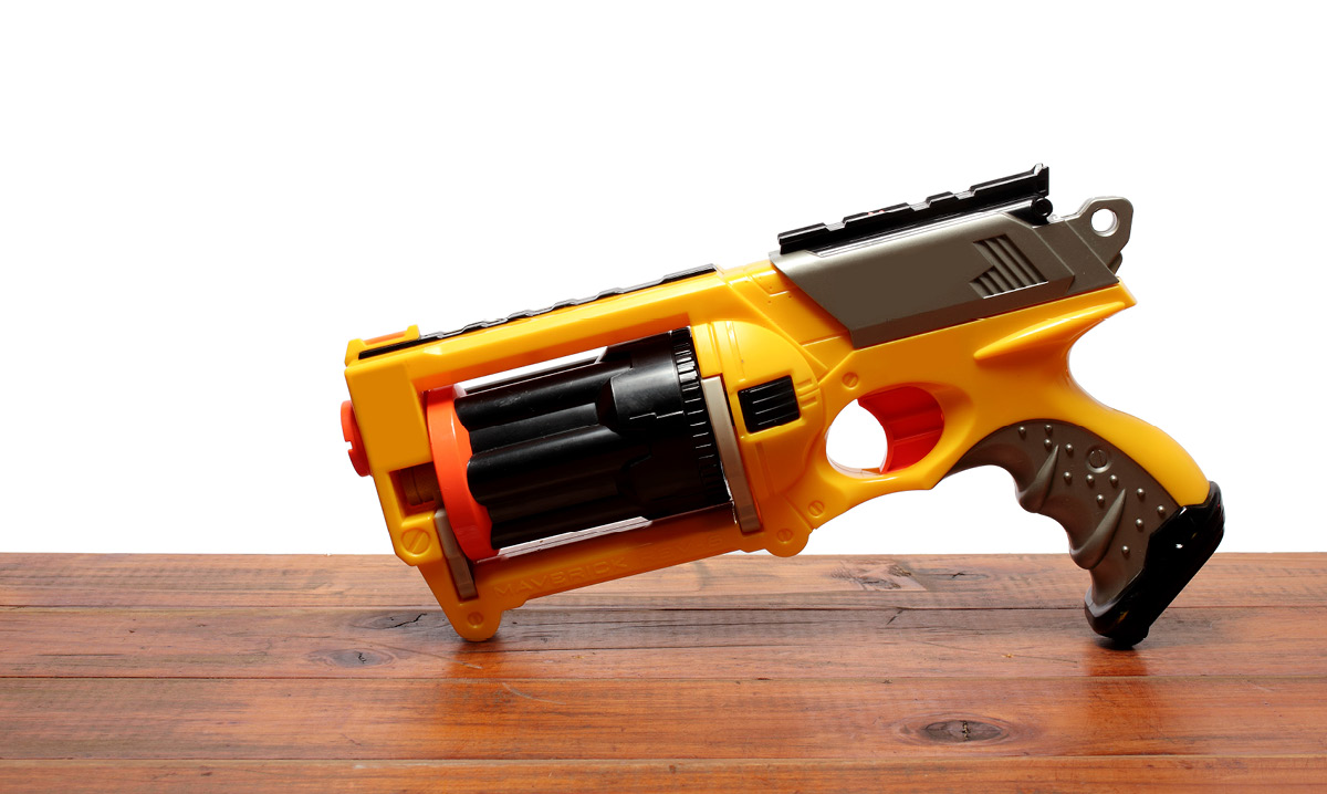 Nerf gun sitting on a wood table