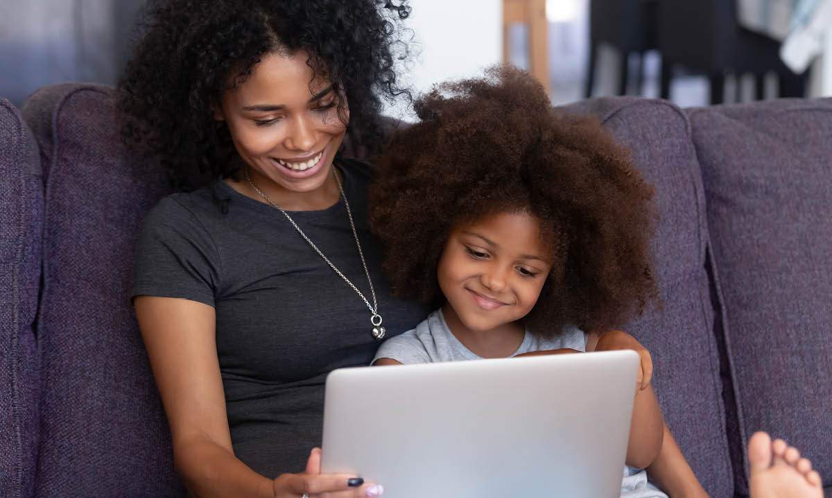 Woman and a child on a computer