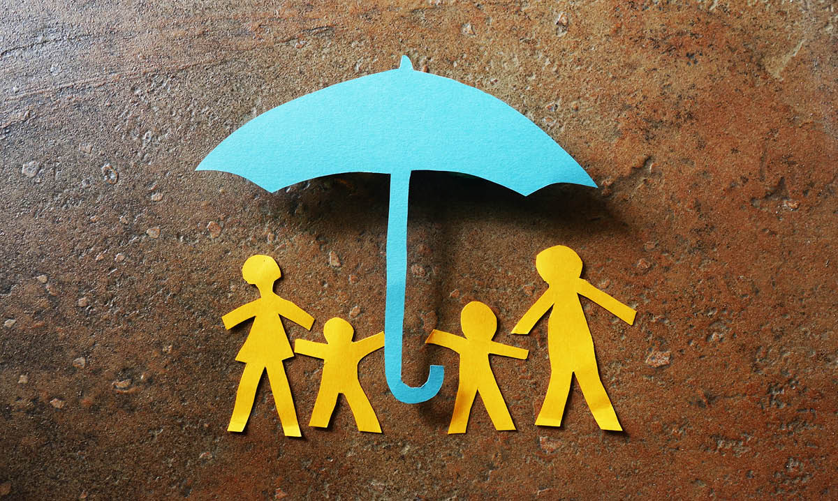 Paper family under an umbrella