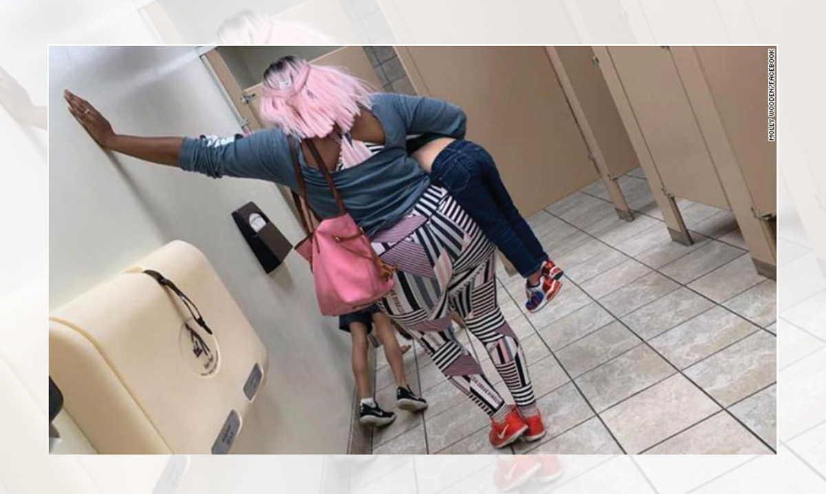 Nicki Harper Quinn watches her son do pushups as punishment