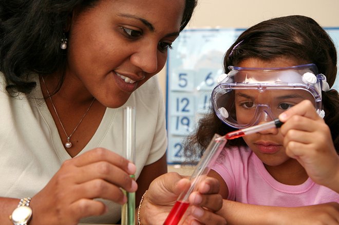 Woman and girl doing science experiments