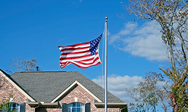 An American flag flying above a building